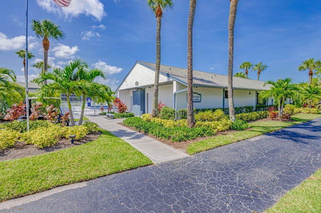 1011 Green Pine Blvd Unit G1, West Palm Beach, FL 33409 - view of home's exterior featuring stucco siding