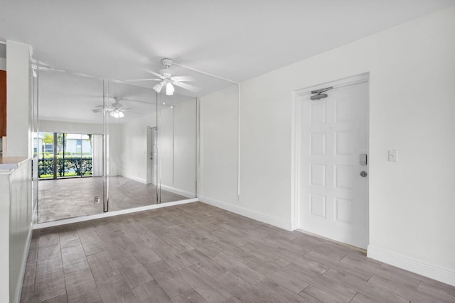 1011 Green Pine Blvd Unit G1, West Palm Beach, FL 33409 - unfurnished room with a ceiling fan, wood finished floors, and baseboards