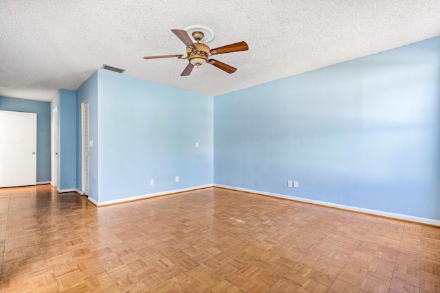 21212 Escondido Way, Boca Raton, FL 33433 - spare room featuring a ceiling fan, baseboards, and a textured ceiling