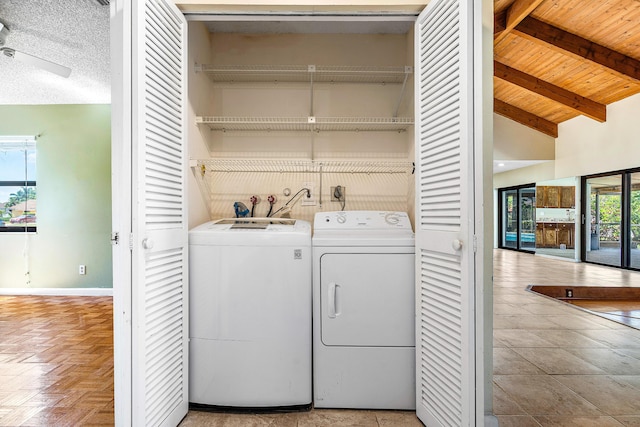 21212 Escondido Way, Boca Raton, FL 33433 - washroom with washing machine and dryer, baseboards, and wooden ceiling