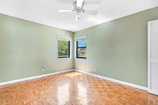 21212 Escondido Way, Boca Raton, FL 33433 - unfurnished room featuring ceiling fan, baseboards, and a textured ceiling