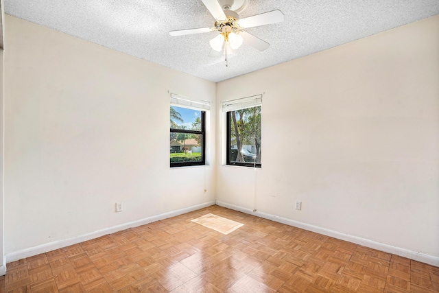 21212 Escondido Way, Boca Raton, FL 33433 - spare room with a textured ceiling, baseboards, and a ceiling fan