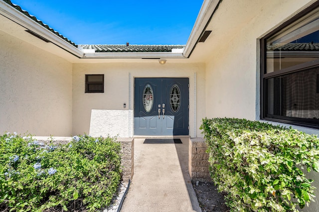 21212 Escondido Way, Boca Raton, FL 33433 - doorway to property featuring stucco siding