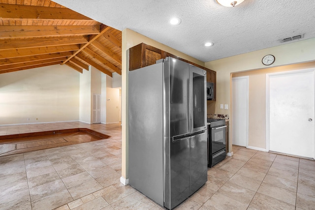 21212 Escondido Way, Boca Raton, FL 33433 - kitchen with freestanding refrigerator, black / electric stove, vaulted ceiling, baseboards, and light tile patterned floors