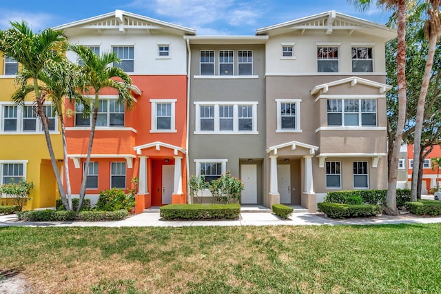 609 Amador Ln Unit 4, West Palm Beach, FL 33401 - view of property with stucco siding and a front lawn