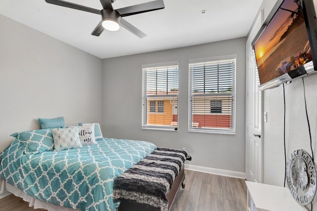 609 Amador Ln Unit 4, West Palm Beach, FL 33401 - bedroom featuring wood finished floors, baseboards, and ceiling fan