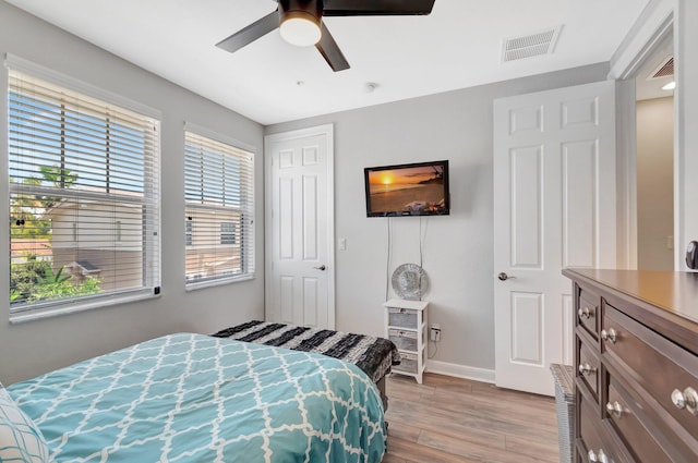 609 Amador Ln Unit 4, West Palm Beach, FL 33401 - bedroom featuring light wood finished floors, baseboards, ceiling fan, and a closet