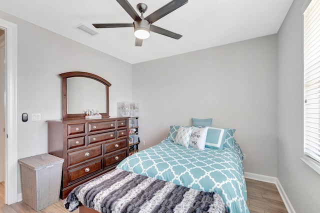 609 Amador Ln Unit 4, West Palm Beach, FL 33401 - bedroom featuring light wood-style floors, multiple windows, baseboards, and a ceiling fan