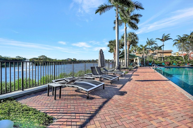 609 Amador Ln Unit 4, West Palm Beach, FL 33401 - view of patio / terrace featuring a water view and a community pool