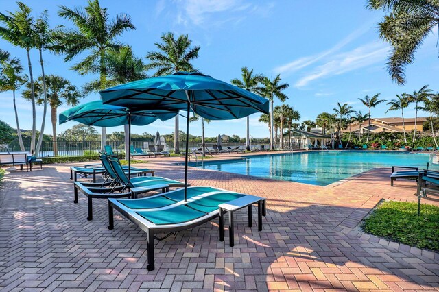 609 Amador Ln Unit 4, West Palm Beach, FL 33401 - community pool featuring a patio area