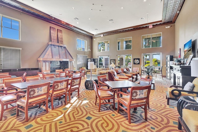609 Amador Ln Unit 4, West Palm Beach, FL 33401 - dining room featuring a towering ceiling, recessed lighting, and light carpet