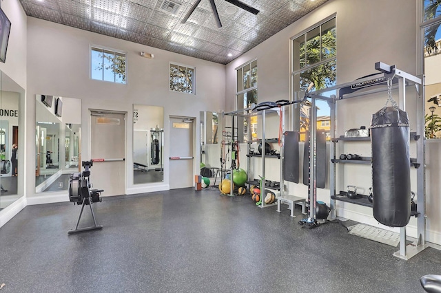 609 Amador Ln Unit 4, West Palm Beach, FL 33401 - gym featuring ceiling fan, a towering ceiling, and baseboards
