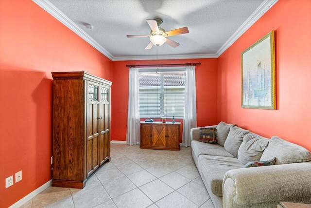 living area with a ceiling fan, ornamental molding, a textured ceiling, light tile patterned floors, and baseboards