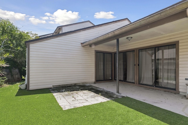 116 Sherwood Cir Unit 7A, Jupiter, FL 33458 - back of property with a patio area and a lawn