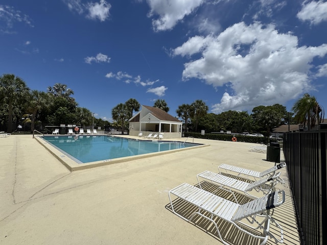116 Sherwood Cir Unit 7A, Jupiter, FL 33458 - community pool featuring a patio and fence