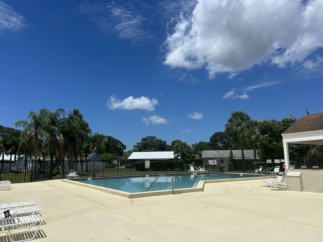 116 Sherwood Cir Unit 7A, Jupiter, FL 33458 - community pool featuring fence and a patio