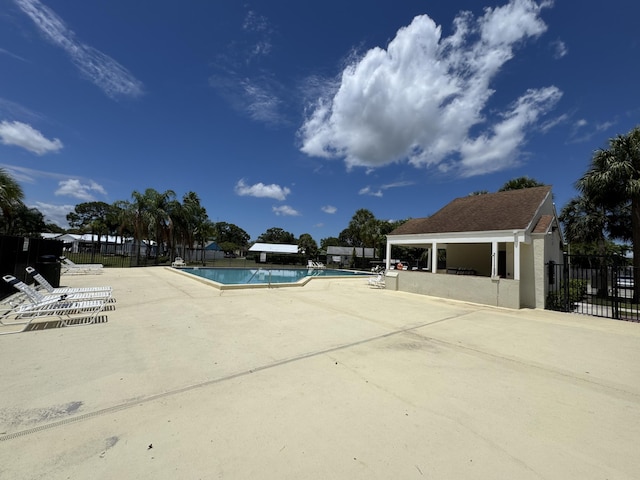 116 Sherwood Cir Unit 7A, Jupiter, FL 33458 - community pool with fence and a patio