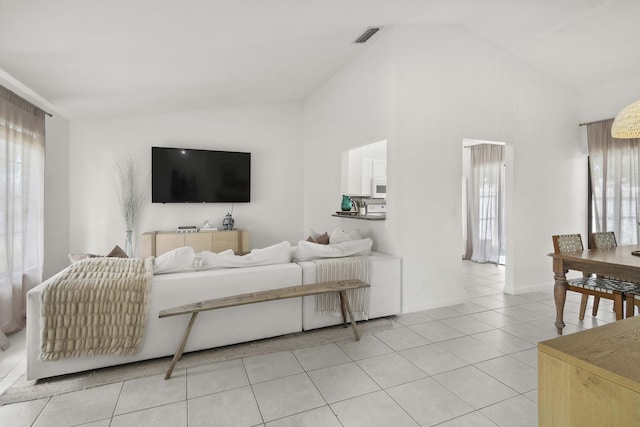 116 Sherwood Cir Unit 7A, Jupiter, FL 33458 - living area featuring light tile patterned floors and high vaulted ceiling