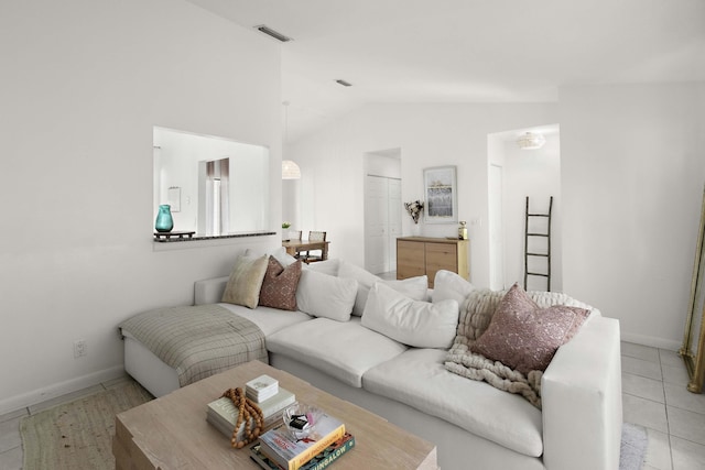 116 Sherwood Cir Unit 7A, Jupiter, FL 33458 - living room featuring lofted ceiling, baseboards, and light tile patterned flooring