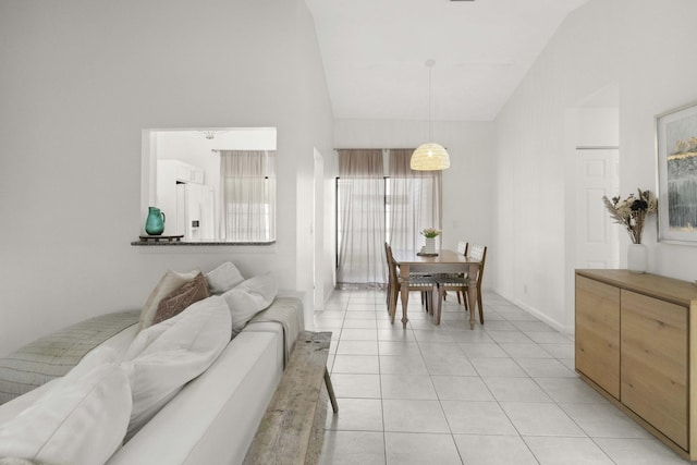 116 Sherwood Cir Unit 7A, Jupiter, FL 33458 - dining area featuring high vaulted ceiling, light tile patterned flooring, and baseboards