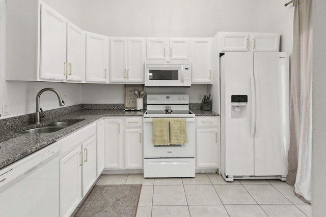 116 Sherwood Cir Unit 7A, Jupiter, FL 33458 - kitchen featuring white appliances, a sink, white cabinetry, and light tile patterned flooring