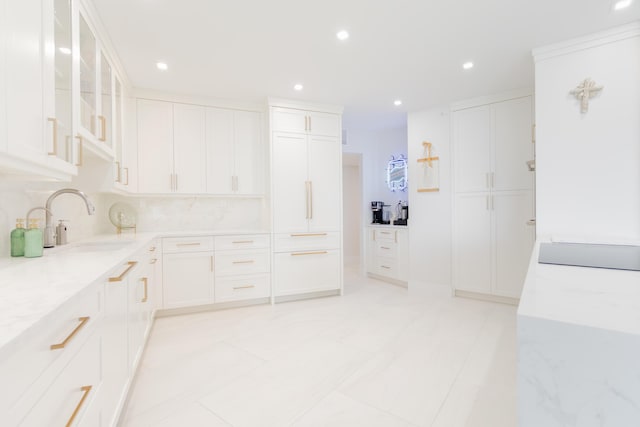 100 Lakeshore Dr Unit 1954, North Palm Beach, FL 33408 - kitchen with a sink, recessed lighting, white cabinets, glass insert cabinets, and light stone countertops