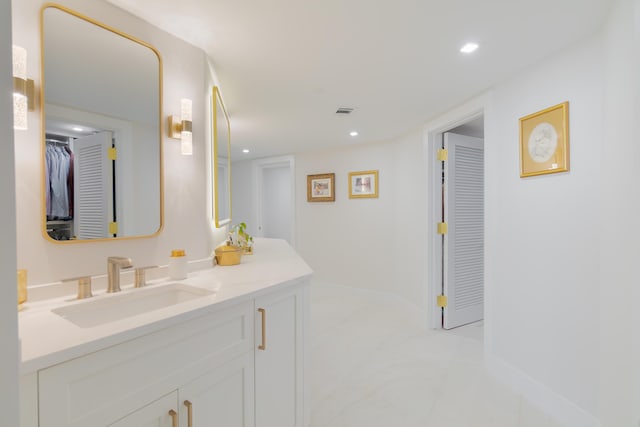 100 Lakeshore Dr Unit 1954, North Palm Beach, FL 33408 - bathroom with vanity, baseboards, recessed lighting, marble look tiles, and a spacious closet