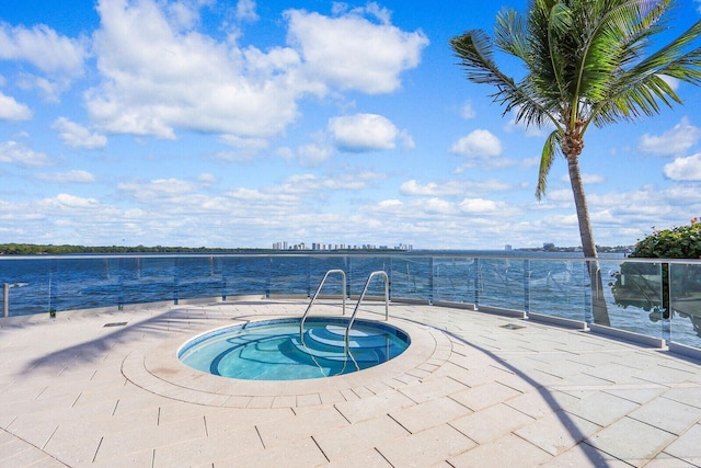 100 Lakeshore Dr Unit 1954, North Palm Beach, FL 33408 - view of swimming pool featuring a community hot tub and a water view