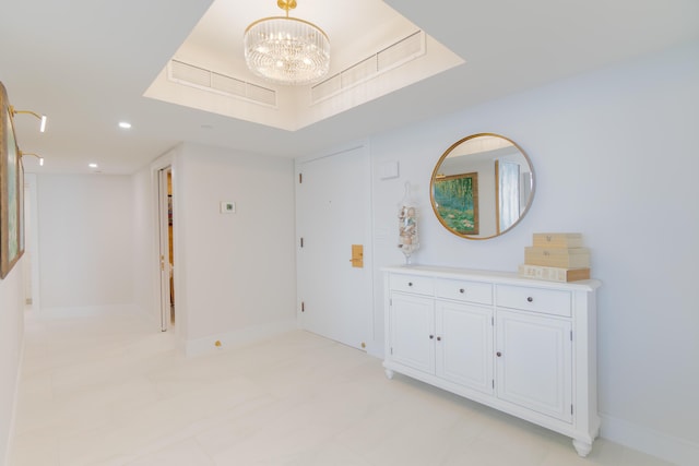100 Lakeshore Dr Unit 1954, North Palm Beach, FL 33408 - hallway with a chandelier, baseboards, recessed lighting, and a tray ceiling