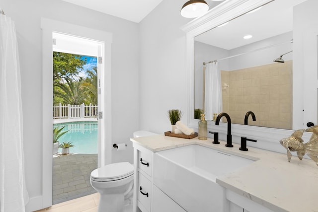 4060 Lake Dr, Coconut Creek, FL 33066 - full bath featuring toilet, vanity, a shower with shower curtain, and tile patterned floors