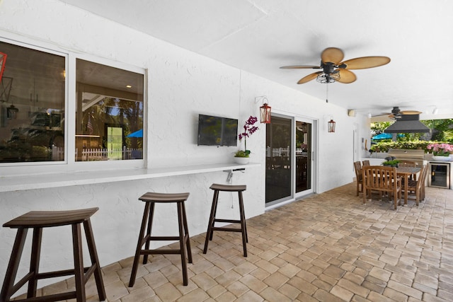 4060 Lake Dr, Coconut Creek, FL 33066 - view of patio featuring a ceiling fan and beverage cooler