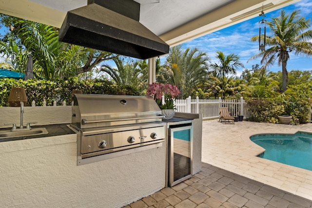 4060 Lake Dr, Coconut Creek, FL 33066 - fenced backyard with a patio area, wine cooler, and a sink