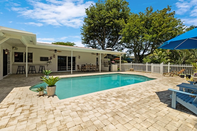 4060 Lake Dr, Coconut Creek, FL 33066 - view of swimming pool with ceiling fan, a patio, and outdoor dining area