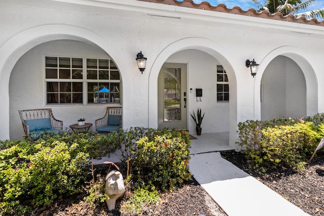 4060 Lake Dr, Coconut Creek, FL 33066 - doorway to property featuring stucco siding and covered porch