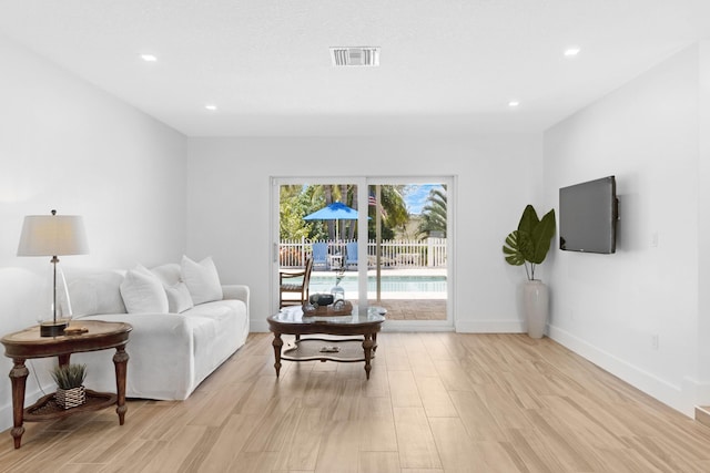 4060 Lake Dr, Coconut Creek, FL 33066 - living area with light wood-style flooring, baseboards, and recessed lighting