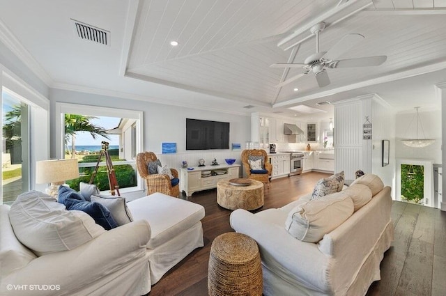 3421 S Ocean Blvd Unit 1, Highland Beach, FL 33487 - living area with a tray ceiling, ceiling fan, dark wood-style flooring, crown molding, and recessed lighting