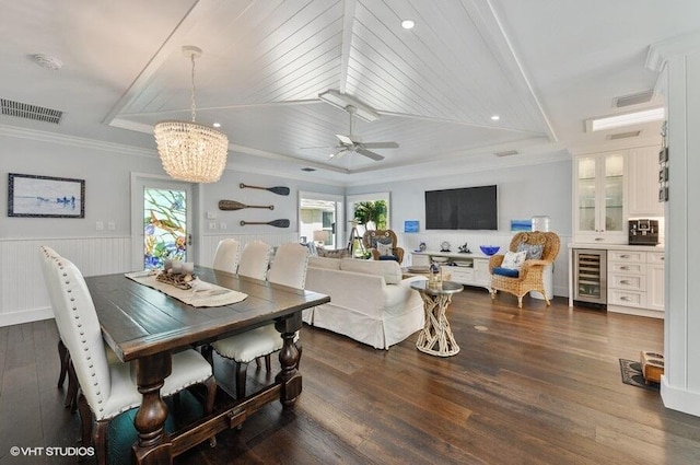 3421 S Ocean Blvd Unit 1, Highland Beach, FL 33487 - dining space featuring wine cooler, healthy amount of natural light, a chandelier, crown molding, and dark wood finished floors