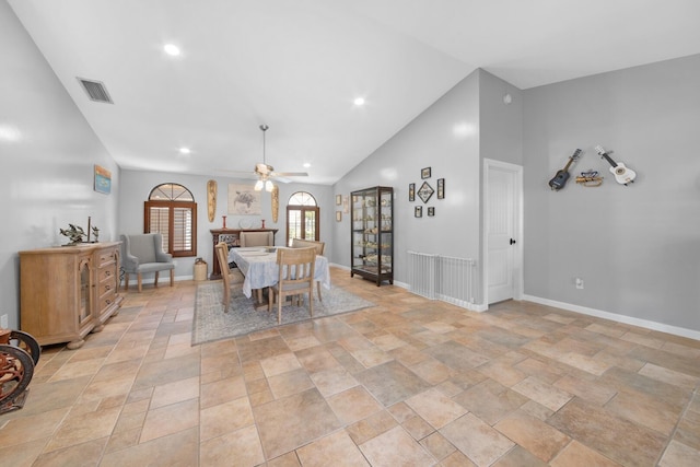 dining room with ceiling fan, lofted ceiling, light stone finish floors, baseboards, and recessed lighting