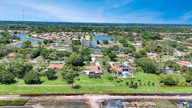 aerial view of residential area featuring a nearby body of water