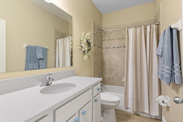 2557 Saint Lucia Cir, Vero Beach, FL 32967 - full bathroom with wood finished floors, vanity, toilet, and shower / bath combo with shower curtain