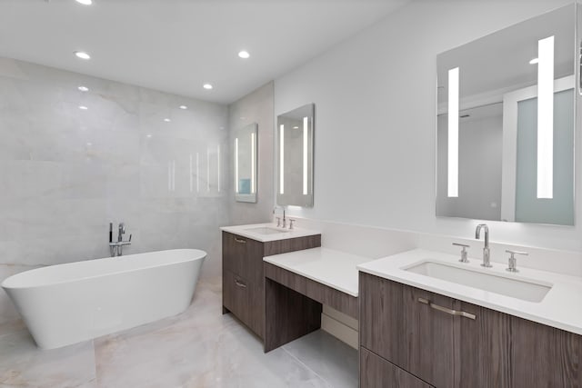 475 E Royal Palm Rd Unit 205, Boca Raton, FL 33432 - bathroom featuring a soaking tub, marble finish floors, vanity, and recessed lighting