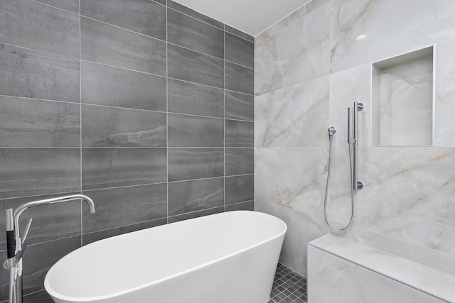 475 E Royal Palm Rd Unit 205, Boca Raton, FL 33432 - bathroom with tile walls, a freestanding bath, and a tile shower