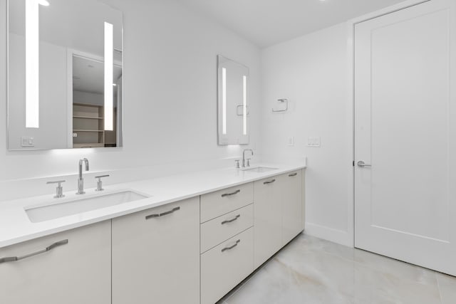 475 E Royal Palm Rd Unit 205, Boca Raton, FL 33432 - bathroom featuring double vanity and baseboards