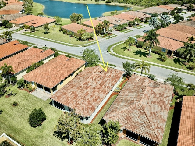 aerial view of residential area with a large body of water