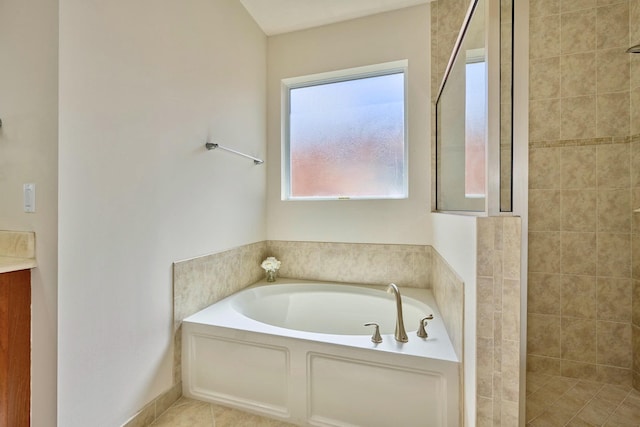 full bathroom with a bath, tiled shower, and vanity