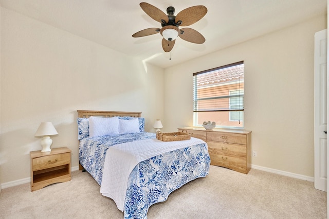 bedroom with carpet flooring, baseboards, and a ceiling fan