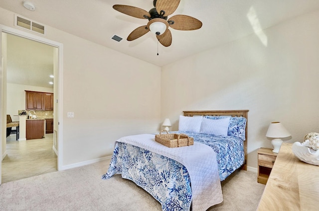 bedroom with baseboards, light colored carpet, and ceiling fan
