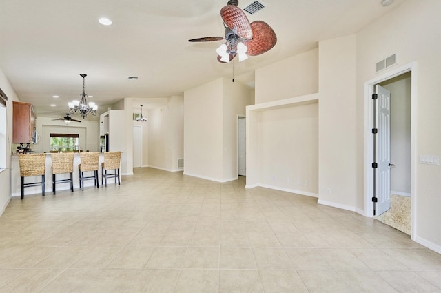 living area with a chandelier, ceiling fan, recessed lighting, light tile patterned flooring, and baseboards