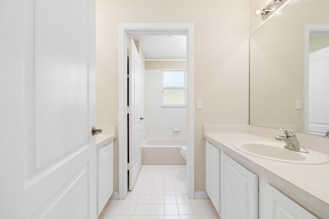 full bathroom with vanity, toilet, tile patterned flooring, and baseboards