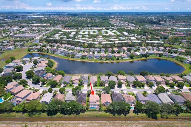 aerial view of residential area featuring a nearby body of water